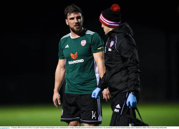 Gavin Peers of Derry City speaks with physio Michael Hegarty as he is substituted due to an injury during the preseason friendly match against Sheriff YC in Janurary, is nearing a return to action.