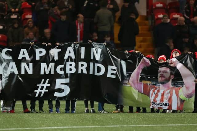 The City Cubs unveil a 'Captain Ryan McBride' banner on the pitch ahead of last Friday's victory over Bray at Brandywell.