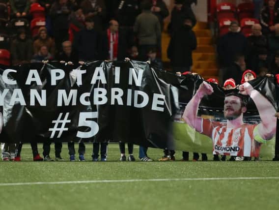 The City Cubs unveil a 'Captain Ryan McBride' banner on the pitch ahead of last Friday's victory over Bray at Brandywell.