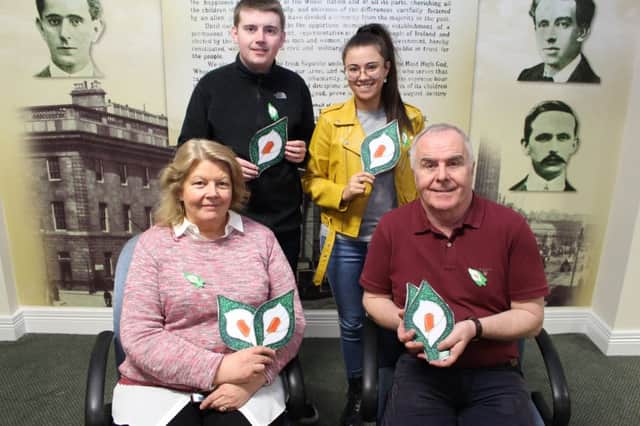 Councillor Patricia Logue, Foyle MLA Raymond McCartney CaolÃ¡n McGinley Chairperson "gra Shinn FÃ©in in Derry, and Lauren Hegarty Martin McGuinness Cumann at the annual launch of the Easter Liliy in Derry