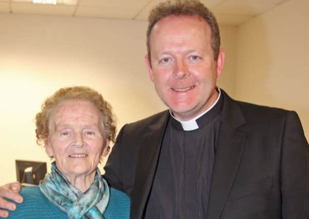 Archbishop (then Monsignor) Eamon Martin pictured with his mother, Katie, at the Derry Journal offices on her 85th birthday back in 2013.
2201JM88