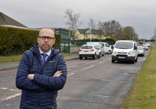Principal Gareth Blackery (pictured) is calling for traffic calming outside St Pauls Primary School Slievemore. DER1218GS010