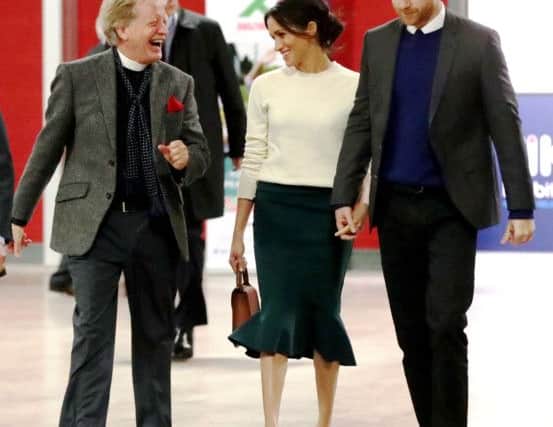 The royal couple pictured at the EIKON Centre with Derry Presbyterian minister, Dr. David Latimer.
