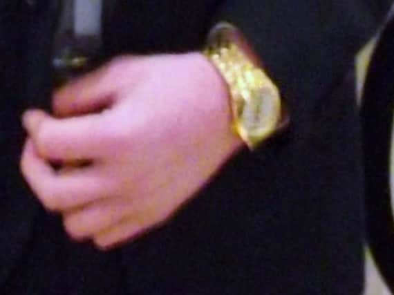 Gold watch stolen.