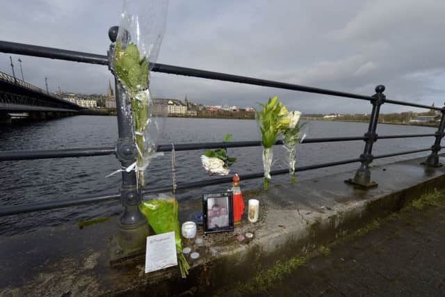 Flowers and momentums for Michael McGinley left beside the River Foyle during the search operation.   DER0618GS029