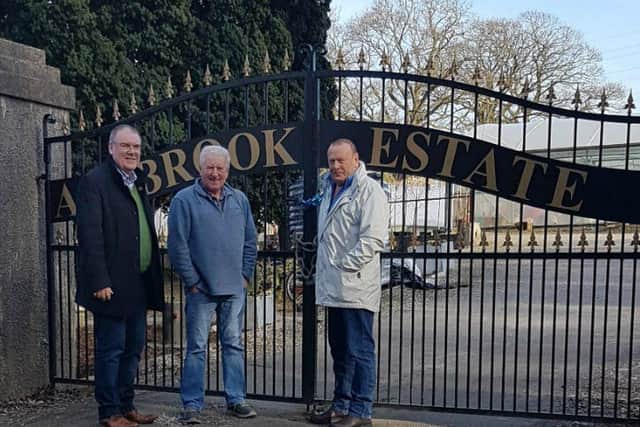 Colr. McKeever and others at the gates of the Ashbrook facility.