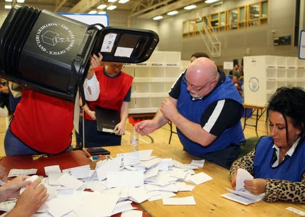 The first ballot papers being sorted at the election count at Foyle Arena Derry last year.