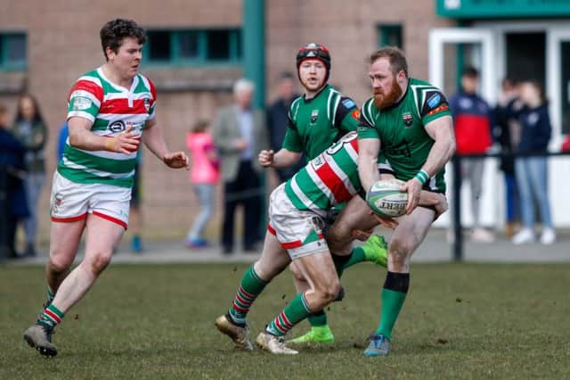 Paddy Blenerhassett of City of Derry gets the back away under pressure against Sundays Well in the Ulster Bank All Ireland Div 2B match at Judges Road.