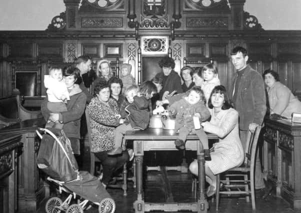 Local people pictured at a sit in in the Guildhall
