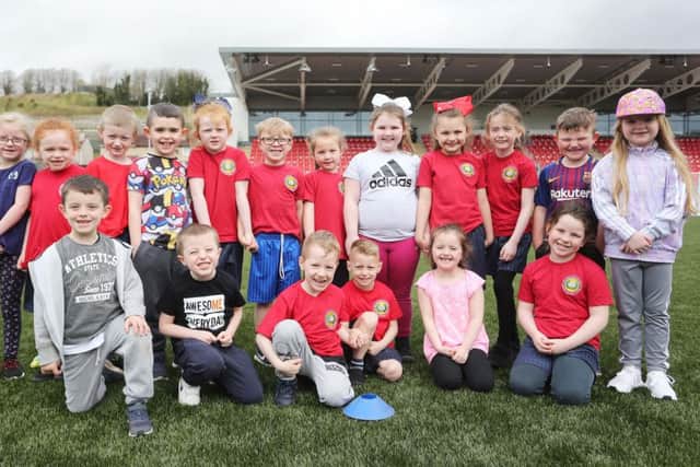 Children from Foyle College and Holy Child Primary School at the official opening of Brandywell Stadium and Greyhound Track