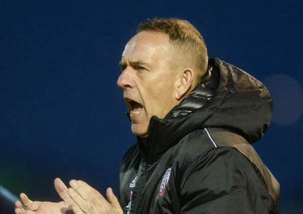 Derry City boss Kenny Shiels expects a tough match in Dundalk tonight.