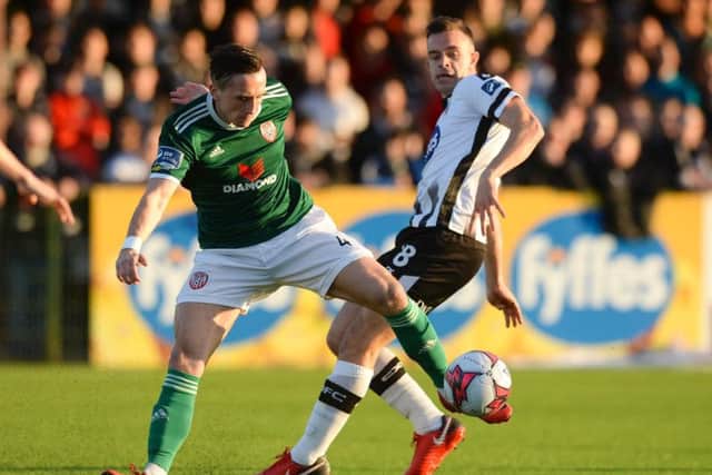 Derry City goalscorer, Aaron McEneff wins the ball from Robbie Benson, the scorer of Dundalk's opening goal at Oriel Park.