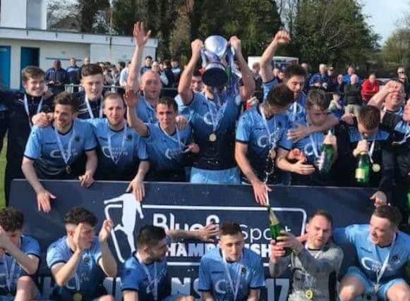 Institute players celebrate winning the Bluefin Sport Championship title.