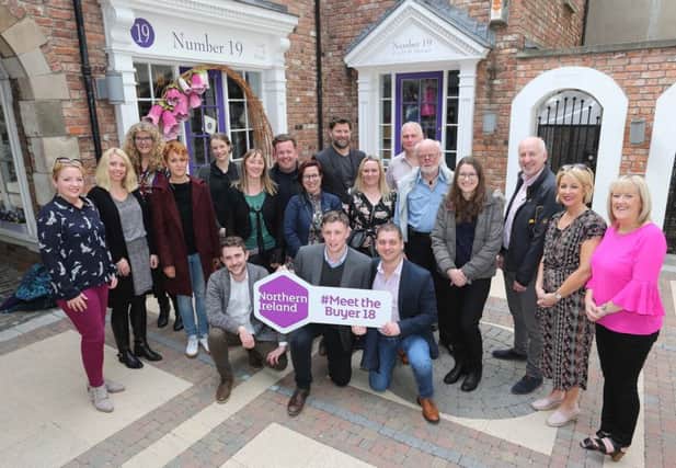 International tour operators at the Craft Village with Karen Henderson, Visit Derry (standing, second right); Aoife Fee, Tourism NI (standing left) and David McAnirn, tour guide (standing, third right).
Pic by Lorcan Doherty .