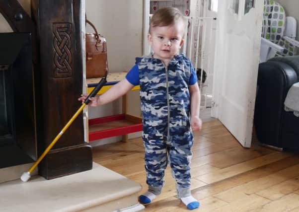 Caleb with his cane.