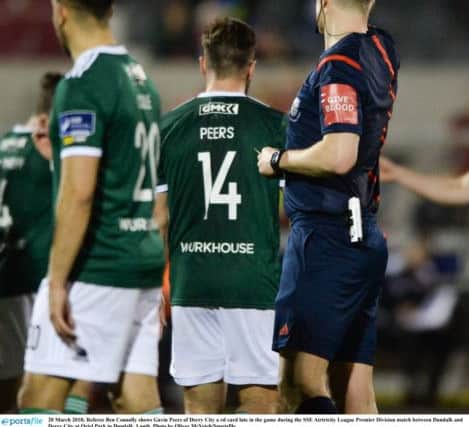 Referee Ben Connolly shows Gavin Peers of Derry City a red card late in the game during the SSE Airtricity League Premier Division match between Dundalk and Derry City at Oriel Park.