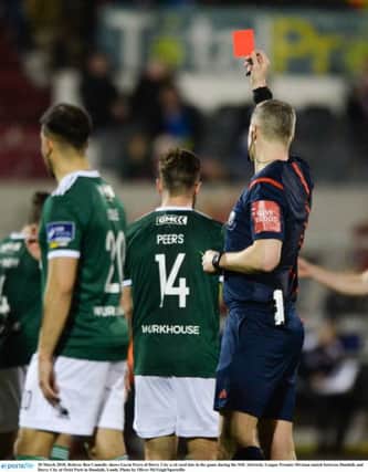 Referee Ben Connolly shows Gavin Peers of Derry City a red card late in the game during the SSE Airtricity League Premier Division match between Dundalk and Derry City at Oriel Park.