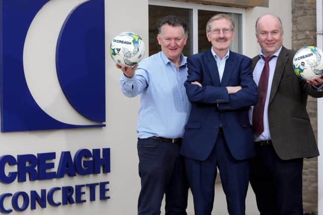 Gerard McKeague (left) and Seamus McKeague, Co Founders of  Creagh Concrete, with Victor Leonard, SuperCupNI chairman. The Toomebridge concrete manufacturing company is again giving major backing to this summers international youth football tournament
