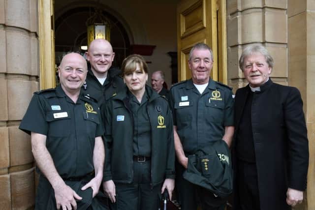 Rev Dr. David Latimer pictured with members of the Ambulance Service who attended the service in First Derry Presbyterian Church on Sunday morning. DER1718-117KM