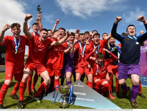 Carndonagh Community School celebrate after being crowned Bank of Ireland FAI Schools Dr. Tony ONeill Senior Cup champions.