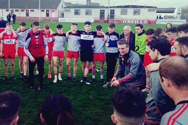 Derry minor manager Paddy Campbell (centre, left) and his back room team talk to the squad after last weeks dramatic win over Monaghan in Celtic Park.