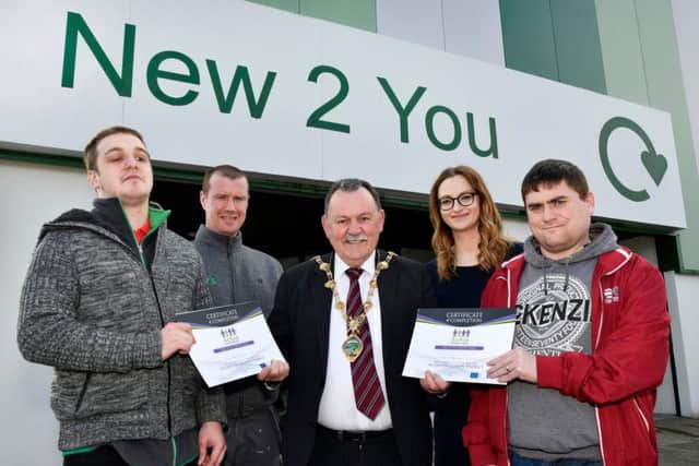 The Mayor, Councillor Maoliosa McHugh presenting cerficiates to Alan Burnside, left, and Paul Hegarty, right, who have successfully competed the Active Inclusion Project programme at New 2 You, Pennyburn Recycling Centre. Included are Kelvin Casson, tutor, and Collette Coyle, Active Inclusion Project team leader.