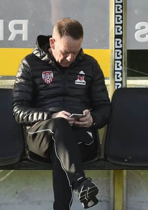 Derry City manager Kenny Shiels consults his fixture schedule ahead of a busy period.