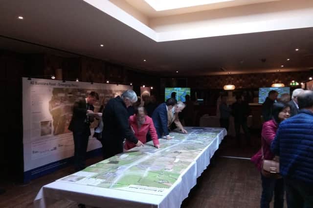 Local people perusing the plans for widening the Buncrana Road.