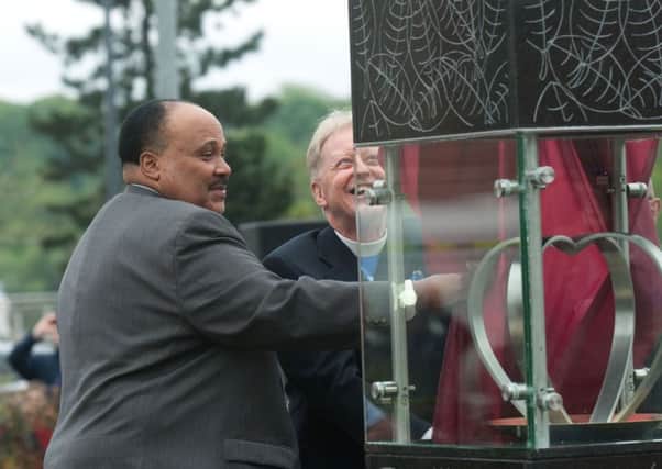 Martin Luther King III and Rev Dr. David Latimer unveiling the Peace Flame back in 2013. INLS2113-176KM