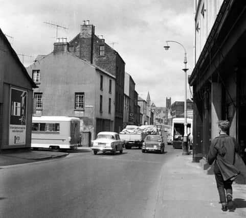 BUSY STREET . . . . Duke Street looking south towards Craigavon Bridge. This photo wasa taken in the early 1960s.