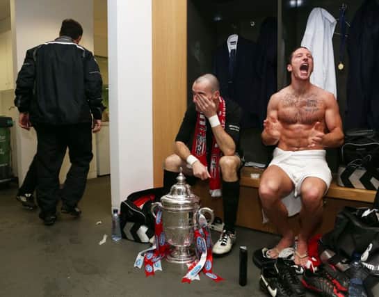 The Agony and the Ecstasy - Derry's Gerard Doherty and Barry Molly in the dressing room following Derry's victory in the FAI Cup in 2012.