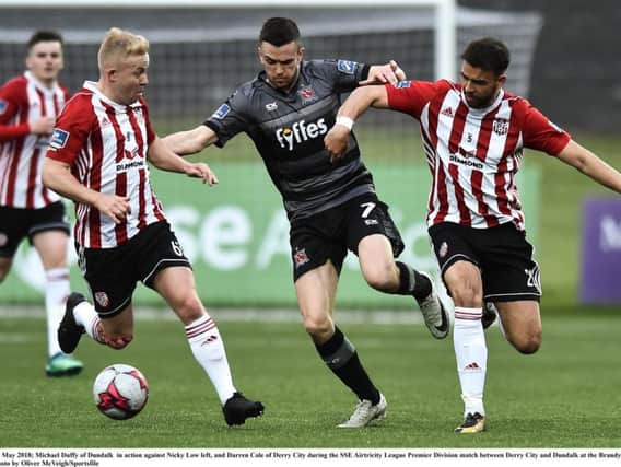 Dundalk goalscorer, Michael Duffy in action against Nicky Low left, and Darren Cole who opened the scoring for Derry,