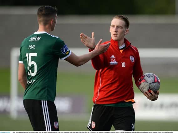 Ronan Curtis of Derry City, right, with the match ball after scoring a hat trick against Shelbourne, says he will remain fully committed to Derry City until his move to Portsmouth is complete next month.