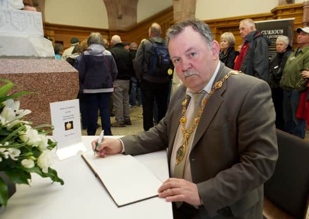 Mayor of Derry City and Strabane District Council MaolÃ­osa McHugh has opened a Book of Condolence at the Guildhall (Photo - Tom Heaney, nwpresspics)