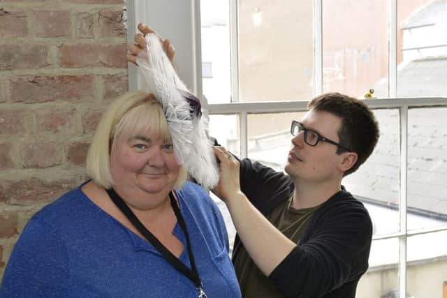 Derry woman Catherine Cooke who will be attending the wedding of Prince Harry and Meghan Markle tomorrow, with her daughter Julie-Ann Coll, getting some last minute adjustments to her hat from designer Paul Stafford at the Fashion Hub, Shipquay Street, during the week. DER2018GS035