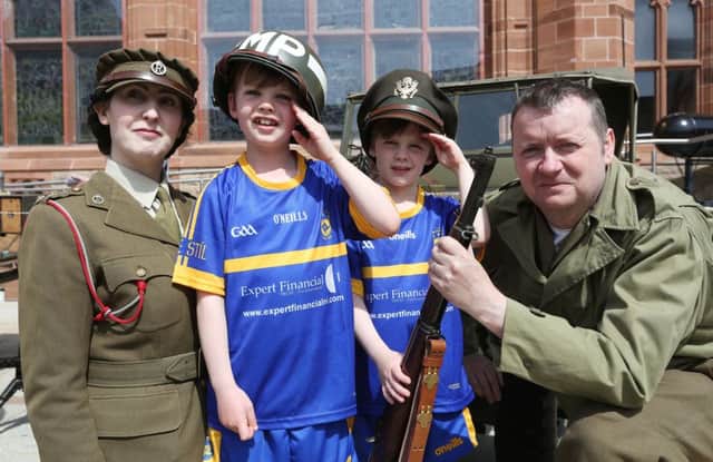 Jack (7) and Eoin (6) McGee 6, from Culmore with Wartime Living History Association's Gillian Clarke and James Ruffin. (Pictures Lorcan Doherty (Â©Lorcan Doherty)