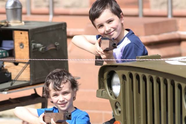Having fun with the vintage displays at the U-Boat surrender celebration in the city on Saturday. (pics Lorcan Doherty).