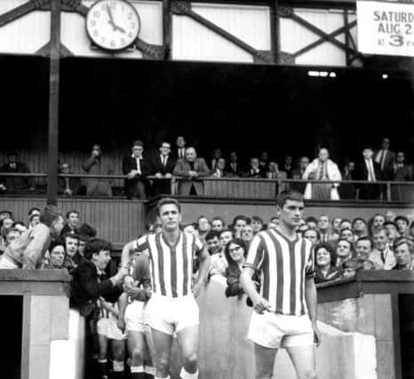 1964... John Crossan and Brian Clough make their way up the tunnel at Sunderland's Roker Park.