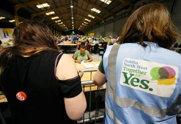 Tally keepers from both sides of the campaign at the count centre in Dublins RDS as votes are counted in the referendum on the 8th Amendment of the Irish Constitution.