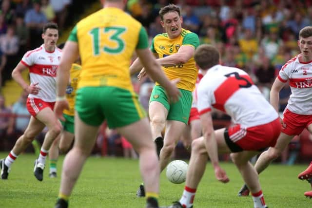 Donegal's Hugh McFadden scores his side's crucial first half goal against Derry.