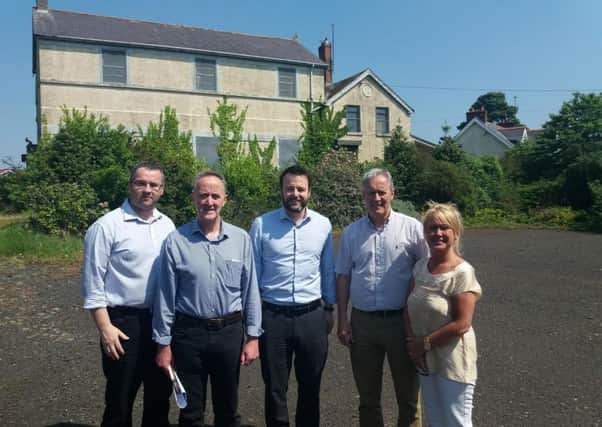 SDLP Leader Colum Eastwood pictured with members of the Culmore Community Partnership.