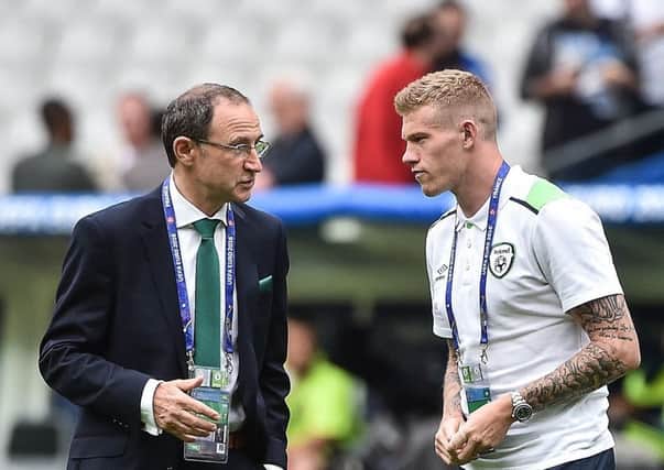 Republic of Ireland manager Martin O'Neill in conversation with Derry's James McClean