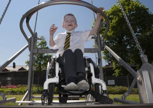 Young Cianan Campbell (Model PS), one of the first youngsters to try out the swing at Brooke Parks new wheelchair friendly play area on Wednesday afternoon during the official opening by the Mayor of DCSDC, Councillor Maoliosa McHugh. (Photos: JIm McCafferty Photography)