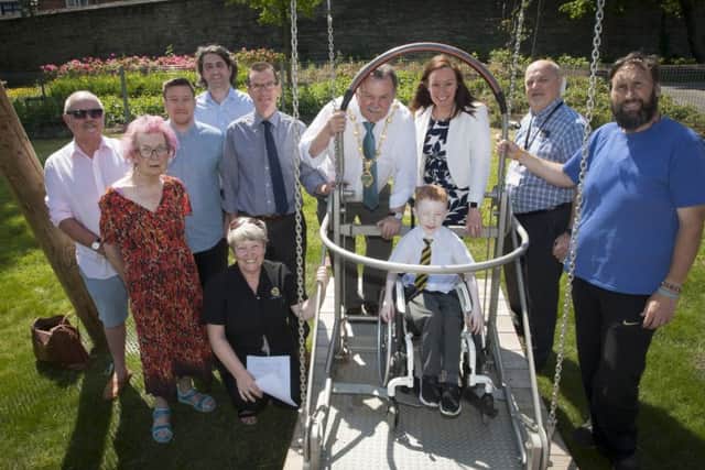 MAYOR OPENS NEW WHEELCHAIR-FRIENDLY PLAY AREA. . . .The Mayor of Derry City and Strabane District Council, Maoliosa McHugh pictured with young Young Cianan Campbell (Model PS), one of the first youngsters to try the new wheelchair-friendly swing at Brooke Park on Wednesday afternoon. Included are Aine Downey, Councillor Darren OÃ¢Â¬"Reilly, Paul McNaught and Damian Mulholland, Department for Communities, Karen Phillips, Director of Environment and Regeneration, DCSDC, Conor Canning, Head of Environment, DCSDC and Dalton Keogh.