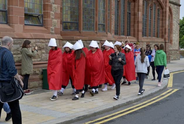 Pro Choice supporters dressed as handmaidens at the abortion rights campaign group ROSA, Reproductive Rights Against Oppression, Sexism and Austerity rally at Guildhall Square on Thursday evening last. DER2218G026