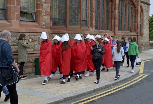 Pro Choice supporters dressed as handmaidens at the abortion rights campaign group ROSA, Reproductive Rights Against Oppression, Sexism and Austerity rally at Guildhall Square on Thursday evening last.  DER2218G026