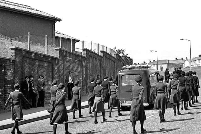 Colour party following the cortege at the funeral of Dennis Heaney in June 1978.