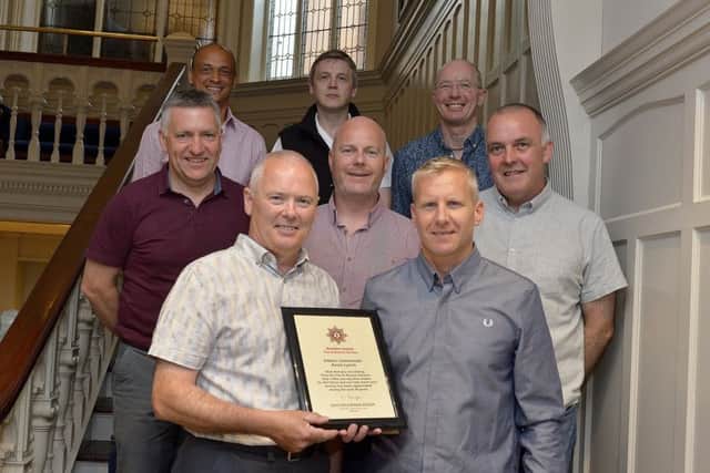 NIFRS Western Area Commander Jonathan Tate (right) presents Station Commander Kevin Lynch with a certificate at his recent retirement party held in the Bishops Gate Hotel. Included in the photograph are Station Commanders Peter McDermott, Andy Burns, Paul Coyle, Simon Green Charlie Lowry and Kieran Doherty.  Station Commander Lynch served 30 years in the Fire and rescue Service.  DER2318GS040