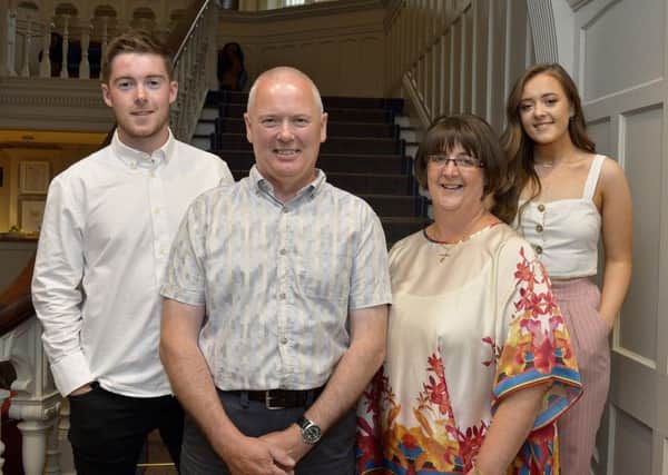 NIFRS Station Commander Kevin Lynch pictured with his wife Fiona, son James and daughter Caoimhe at his recent retirement party held in the Bishops Gate Hotel.  Station Commander served over 30 years in the fire and rescue service. DER2318GS038