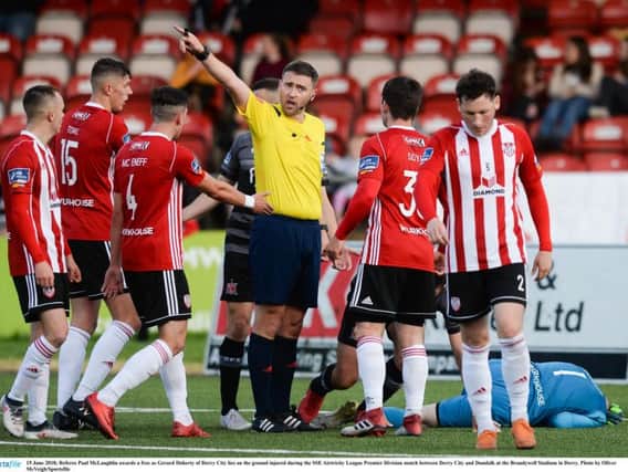 Match referee Paul McLaughlin awards Derry City a free kick after a foul on Gerard Doherty.